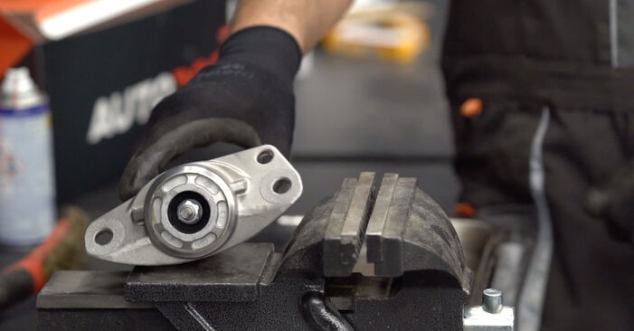 Sustitución de Copelas Del Amortiguador en un VW Passat NMS 3.6 FSI 2013: manuales de taller gratuitos