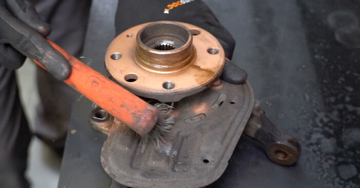 How to change Wheel Bearing on OPEL COMBO Tour 2002 - tips and tricks
