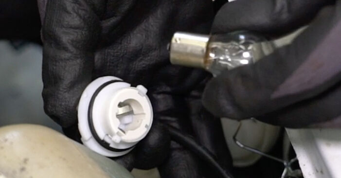 Changing of Headlight Bulb on Mercedes A124 Convertible 1993 won't be an issue if you follow this illustrated step-by-step guide